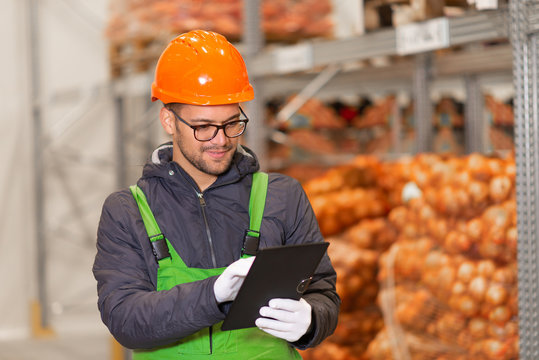 Young Man Working At Healthy Food Production.