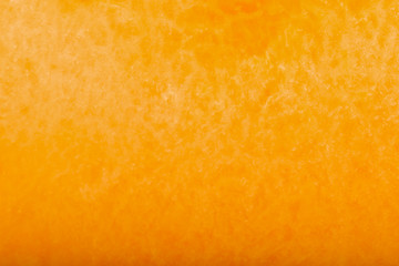 section of fresh orange cantaloupe without seeds background