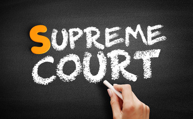 Supreme Court text on blackboard, concept background