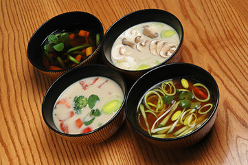 Japanese Cuisine - Miso Soup with vegetables and Tofu Cheese on a wooden table. Soup set