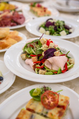 Food Table Celebration Delicious Party Meal Concept. A lot of food. Served for wedding, anniversary, other holiday. Banquet dishes in the restaurant