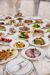 Food Table Celebration Delicious Party Meal Concept. A lot of food. Served for wedding, anniversary, other holiday. Banquet dishes in the restaurant