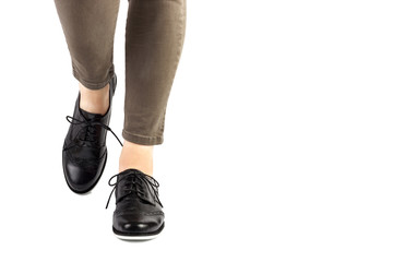 woman legs wearing jeans and shoes isolated on white background