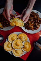 mussel in the shell in the hands of a woman