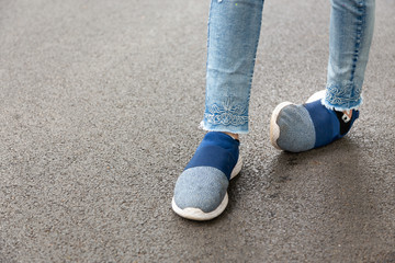Crippled,woman disabled,people with disabilities or accident ankle sprain while jogging,run at...