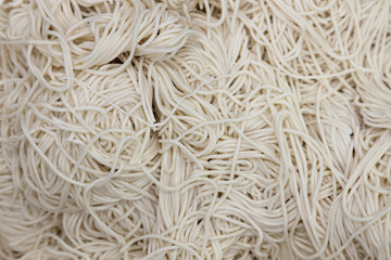 fresh homemade japanese soba ramen noodle or chinese egg noodle preparing to cook for delicious menu at asian restaurant in china town. food concept.