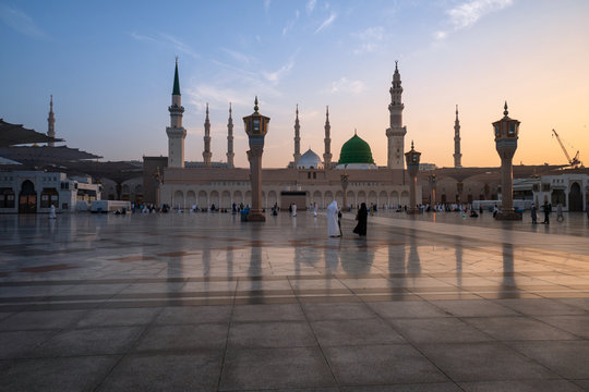 Muslims wearing traditional clothing in the temple of the Nabawi Mosque
