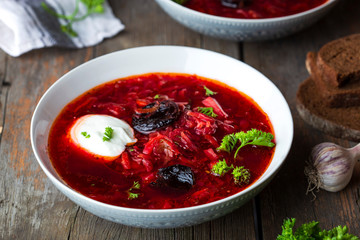 Traditional borscht with prunes and sour cream
