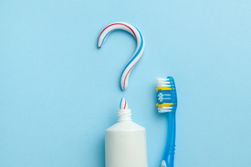 Question mark from toothpaste. The concept of choosing good toothpaste for teeth whitening. Tube of...