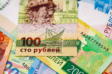 one hundred Russian rubles close-up against the background of cash