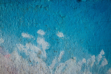 Abstract background in blue shades on a very rough and textured background.