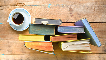 reading, education, literature,learning w. row of books, cup of coffee flat lay