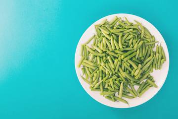 Asparagus beans on a white plate.