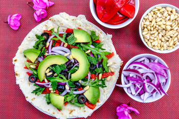 Healthy Vegetarian Avocado Salad on a Pizza Base