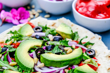 Healthy Vegetarian Avocado Salad on a Pizza Base