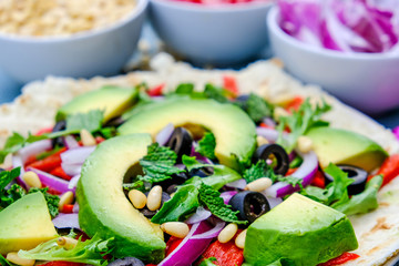 Healthy Vegetarian Avocado Salad on a Pizza Base