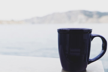 General view of a blue coffee cup outside in nature