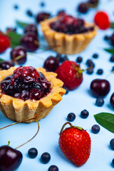 Small berry cake and ripe berries