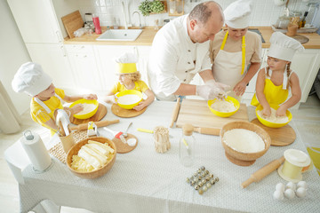Culinary Master Class. Children in the kitchen are cooking. 