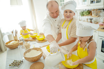 Culinary Master Class. Children in the kitchen are cooking. 