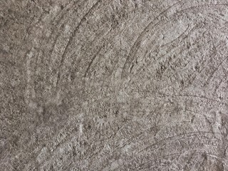cement floor, with patterns similar to waves, background texture for designers, concrete wallpaper