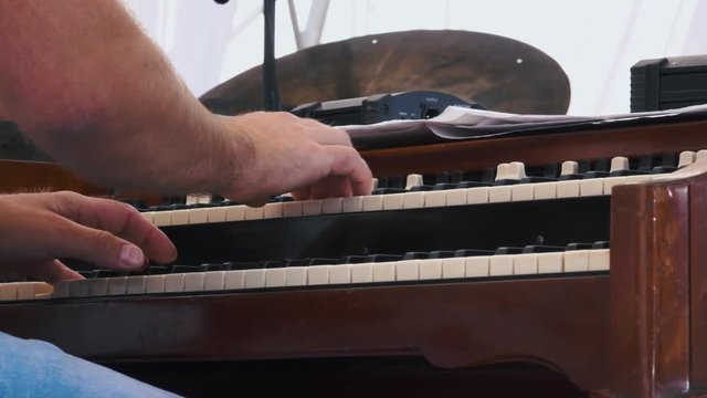 Sow motion. Organist playing a organ concert on festival
