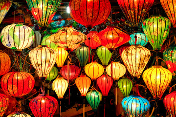 Fototapeta na wymiar Many Colorful Vietnam lantern hanging on the wall at hoi an ancient old town is UNESCO World Heritage Sites in Hoi An , Vietnam