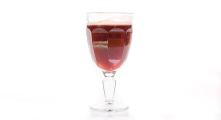 Tasty cherry grog cocktail on a white background