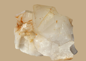Natural Calcite  crystal with  more white and red  tones on a gentle beige background