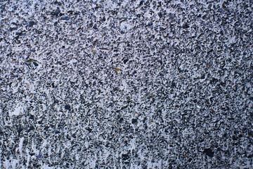 Detail of a gray wall close up. Cinderblock garage, detailing the outside of the garage wall