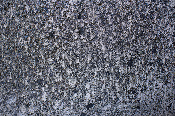 Detail of a gray wall close up. Cinderblock garage, detailing the outside of the garage wall