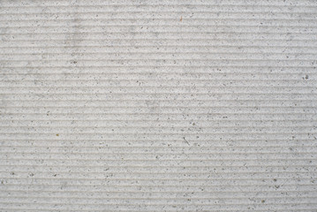 Detail of a gray wall close up. Cinderblock garage, detailing the outside of the garage wall