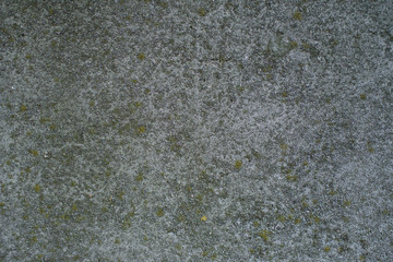 Detail of a gray wall close up. Cinderblock garage, detailing the outside of the garage wall
