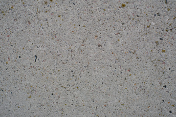 Detail of a gray wall close up. Cinderblock garage, detailing the outside of the garage wall