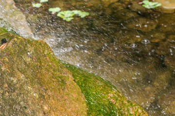 Fragment of a small decorative artificial waterfall