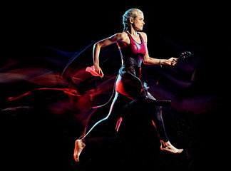 one caucasian woman triathlon triathlete studio shot isolated on black background with light painting effect