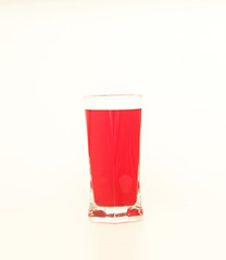 Glass of red liquid on white background, São Paulo, Brazil