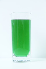 Glass of green liquid on white background, São Paulo, Brazil