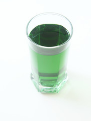 Glass of green liquid on white background, São Paulo, Brazil
