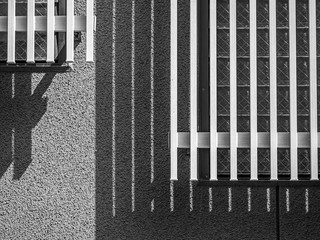 Abstract black and white tone of grids pattern of wooden wall with cement or concrete background.