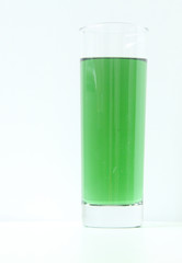 Glass of green liquid on white background, São Paulo, Brazil