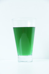 Glass of green liquid on white background, São Paulo, Brazil