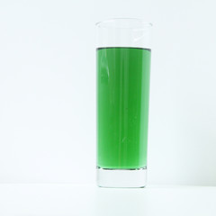 Glass of green liquid on white background, São Paulo, Brazil