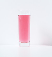 Glass of rose liquid on white background, São Paulo, Brazil