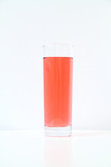 Glass of red liquid on white background, São Paulo, Brazil