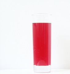 Glass of red liquid on white background, São Paulo, Brazil