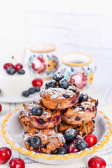 Homemade pastries with ricotta and berries. cheese cake for breakfast. Italian food on a white background. Healthy baking and proper nutrition. Copy space.