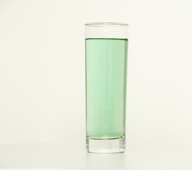 One glass of green liquid on white background, São Paulo, Brazil