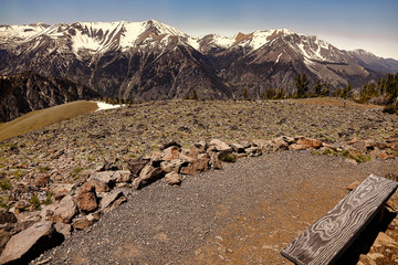 a bench with a view at the top of the world