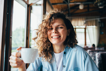 Candid portrait of laughing young woman